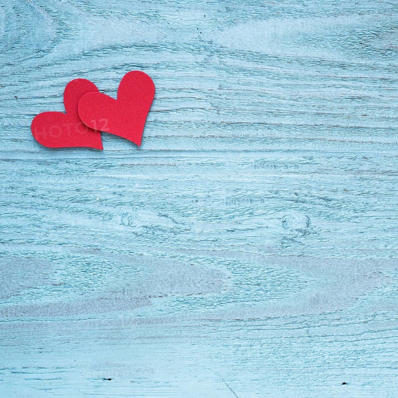 Two red hearts wooden table