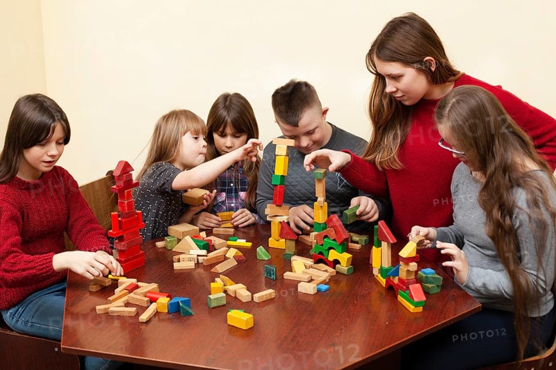 Children with down syndrome playing with toys