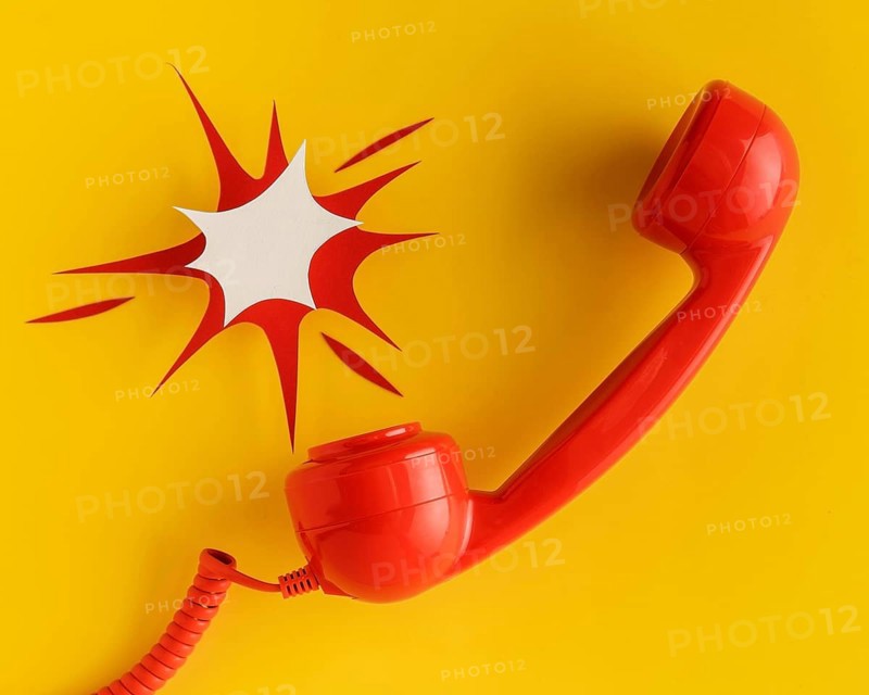 Flat lay vintage telephone receiver with cord paper shape