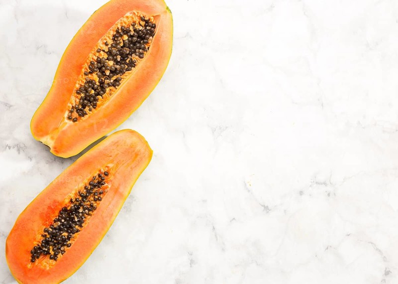 Halves papaya fruit with copy space