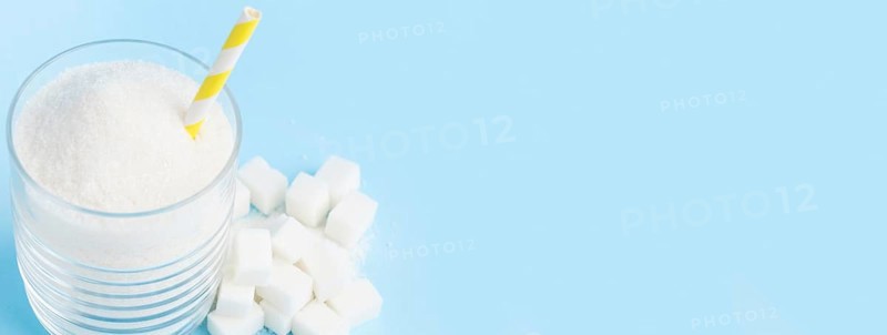 High angle glass with sugar straw