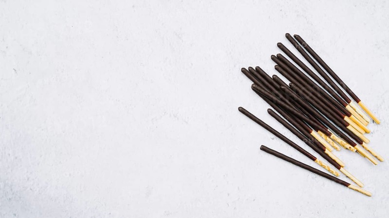 Biscuit sticks chocolate white backdrop