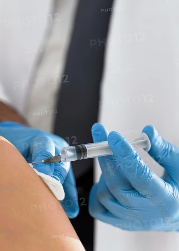 Patient being vaccinated by doctor