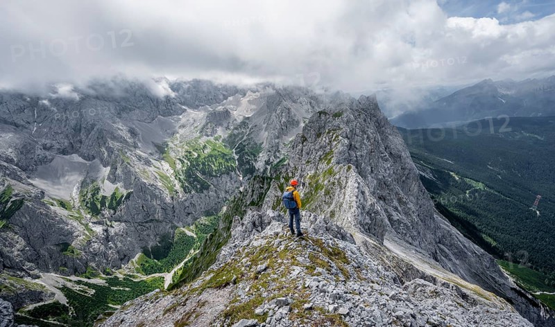 Mountaineer at the summit of the Waxenstein