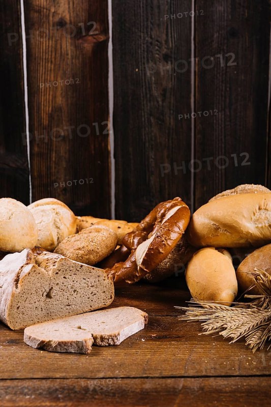 Freshly baked bread wooden textured background