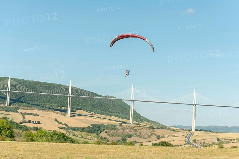 Paraglider in front of the Millau Bridge. Grands Causses