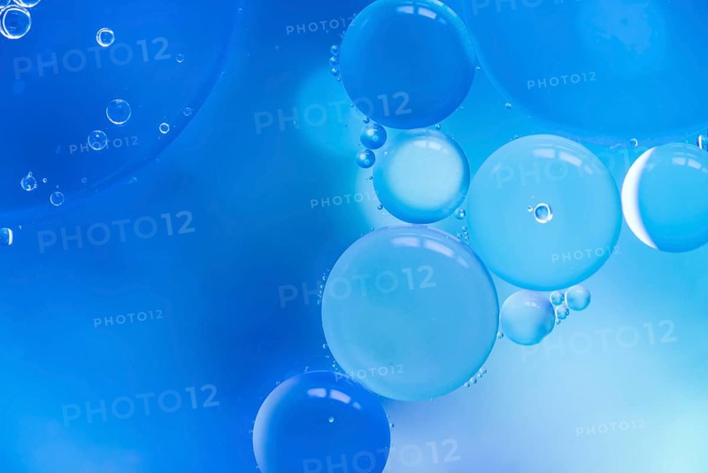 Abstract bubbles blue colored blurred background