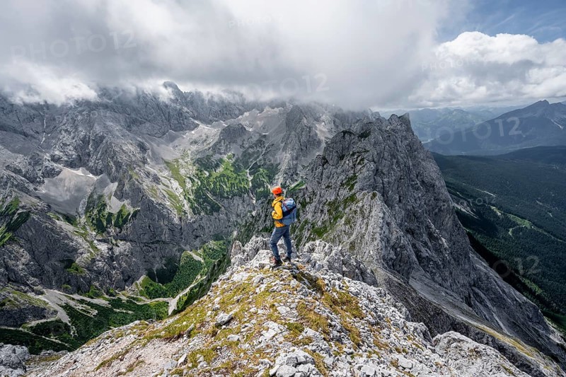 Mountaineer at the summit of the Waxenstein