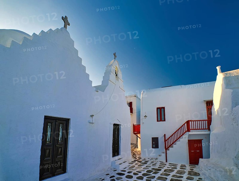 Famous tourist landmark of Greece. Entrance to Greek Orthodox Church of Panagia Paraportiani in Chora