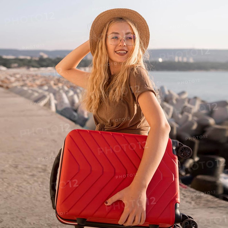 Medium shot happy woman with luggage