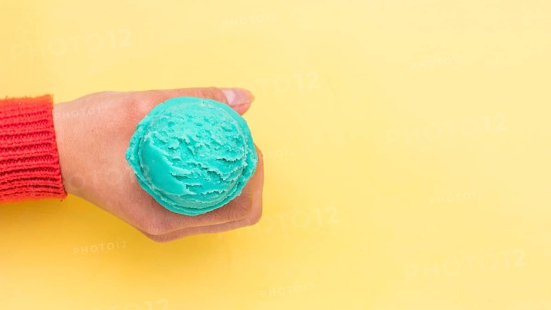 Crop hand holding ice cream