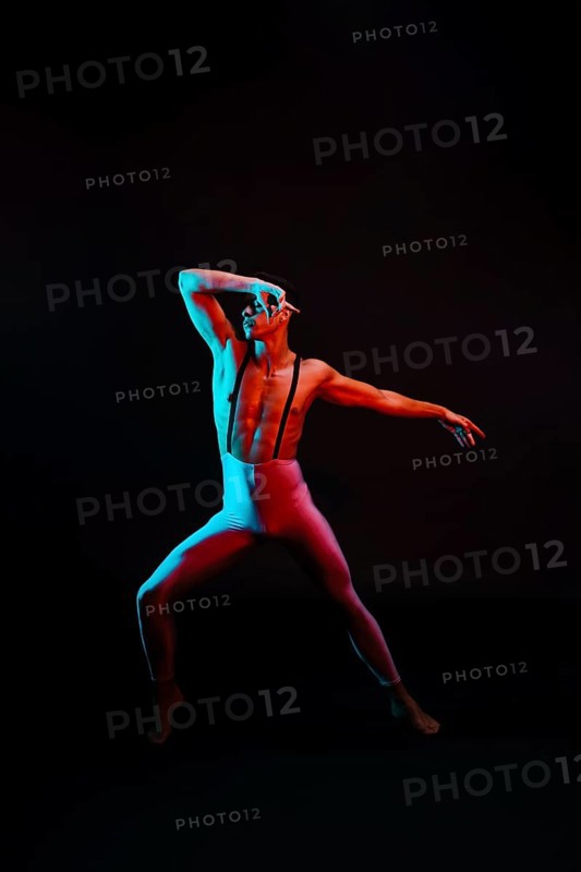 Male ballet dancer leotard with suspenders spotlight