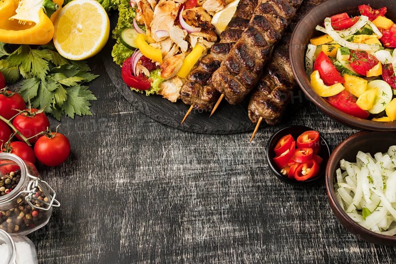 Top view tasty kebabs other dishes with ingredients