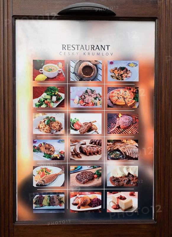 Menu in front of a restaurant in the historic old town of Krumlov