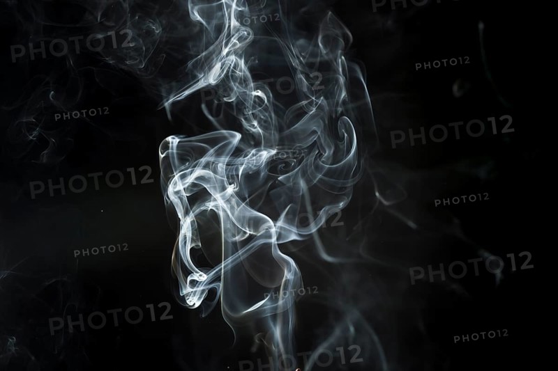 Dark background with delicate white smoke