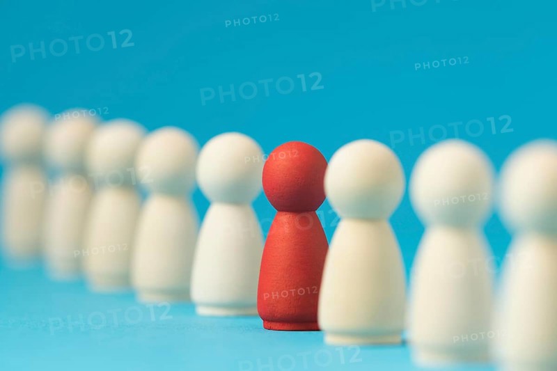 Focused red pawn surrounded by white ones