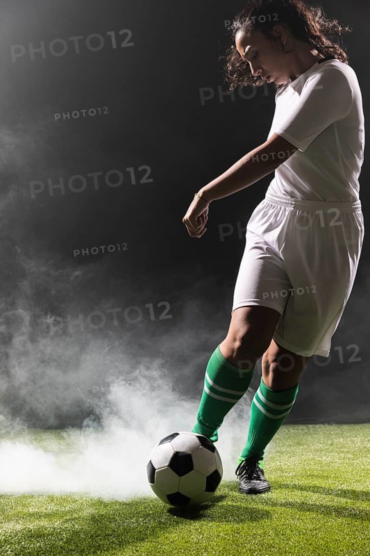 Young woman sportswear playing soccer