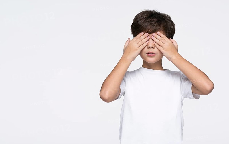 Copy space boy playing hide seek
