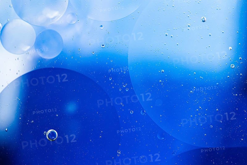 Faded oil drops water surface abstract background