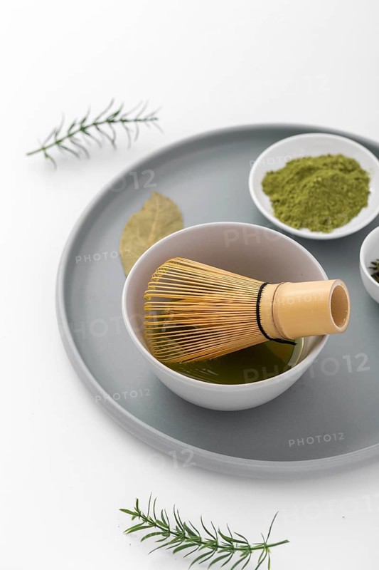 Close up matcha powder bamboo whisk
