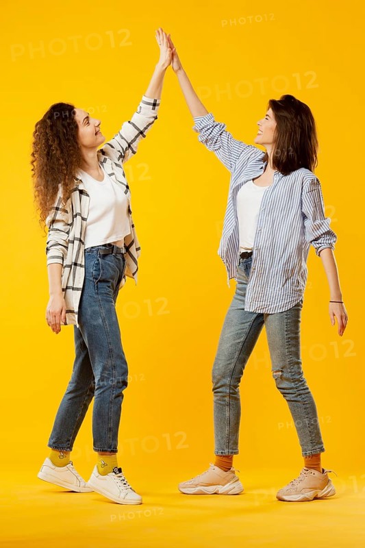 Front view friends giving high five