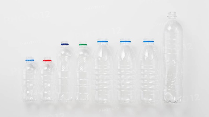 Various types plastic bottles grey background
