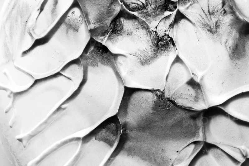 Close up old black white cracked textured wall