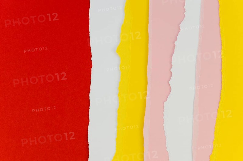 Red yellow vertical torn papers