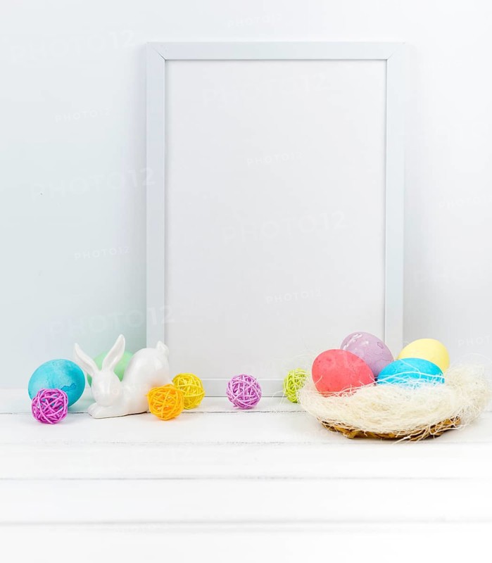 Easter eggs nest with blank frame table