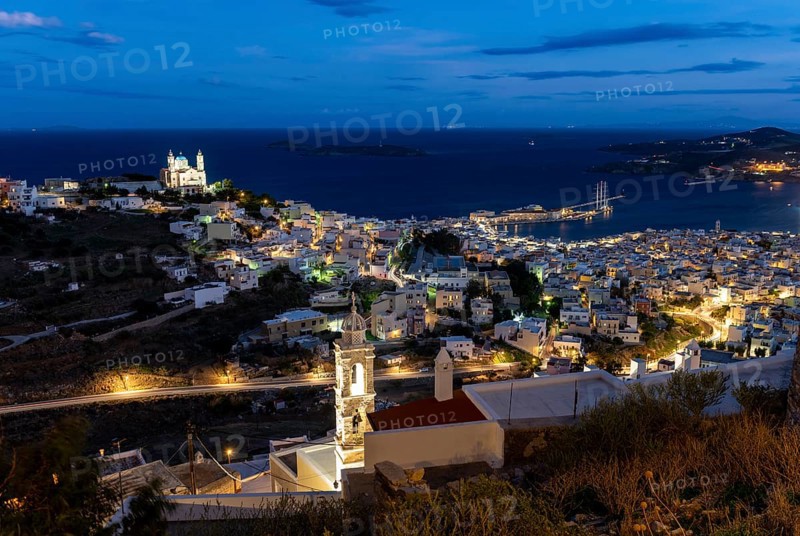 View of the illuminated town of Ermoupoli with Anastasi Church or Church of the Resurrection