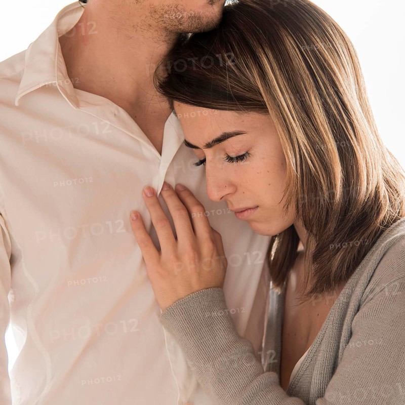 Close up man holding upset woman