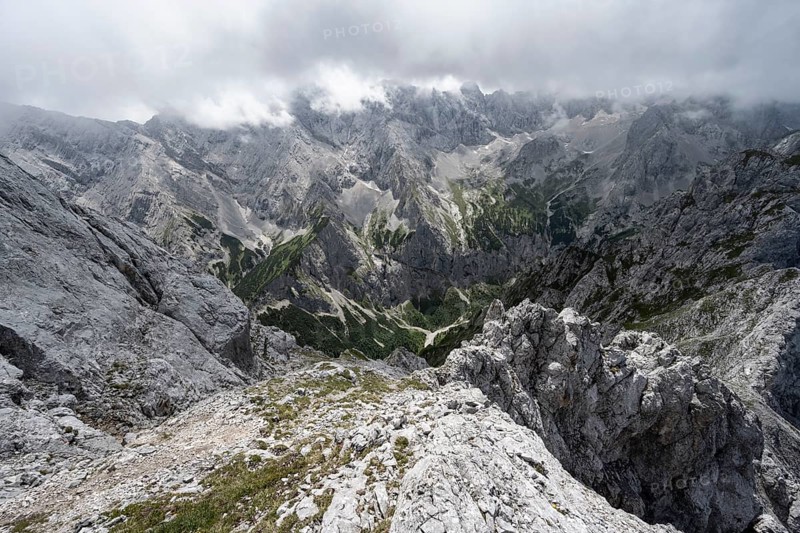 View from the summit of the Waxenstein over rocky and narrow ridge of the Waxenstein ridge to Hoellental with Jubilaeumsgrat