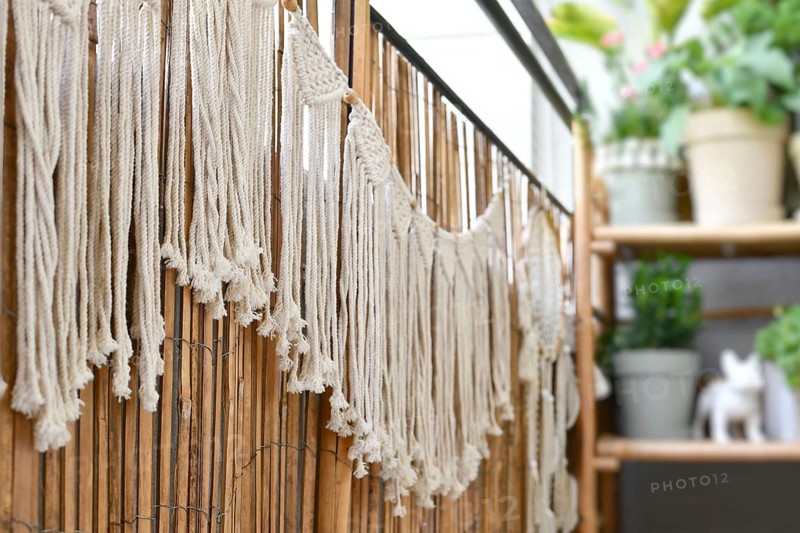 Makramee garland hanging on balcony reed screen