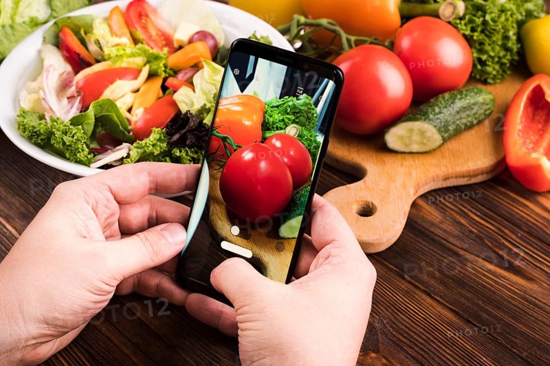 Person taking tomatoes