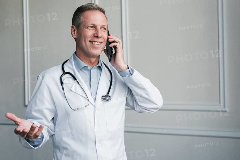 Doctor making phone call