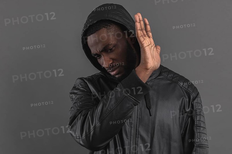 Man looking down holding hand air