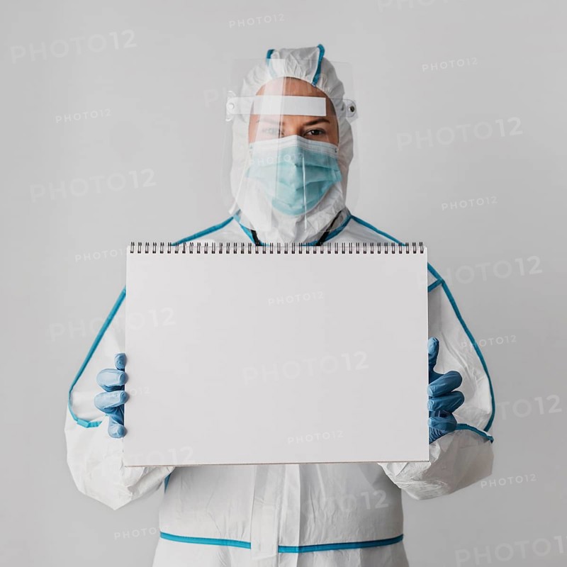 Front view doctor holding blank notebook