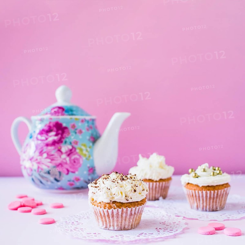 Cupcakes candies teapot white surface