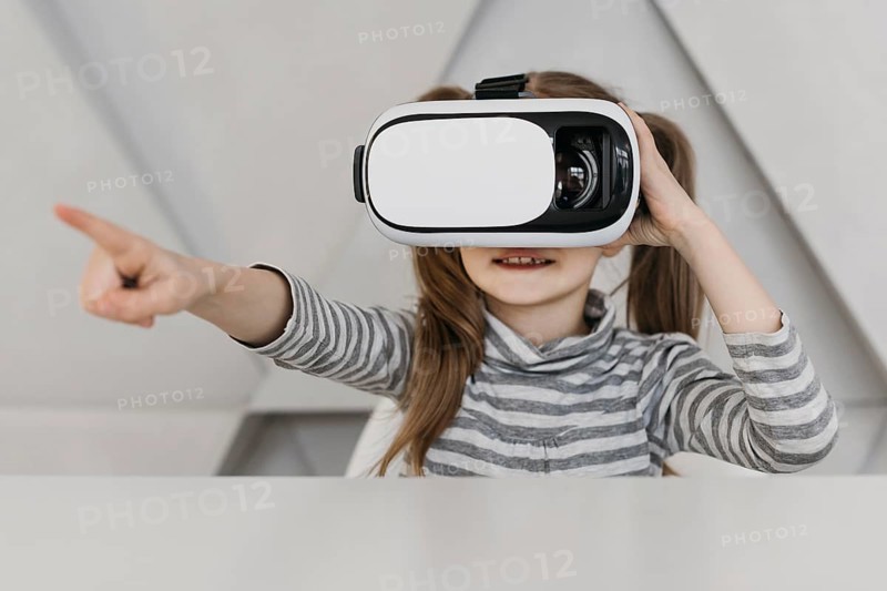 Cute child using virtual reality headset
