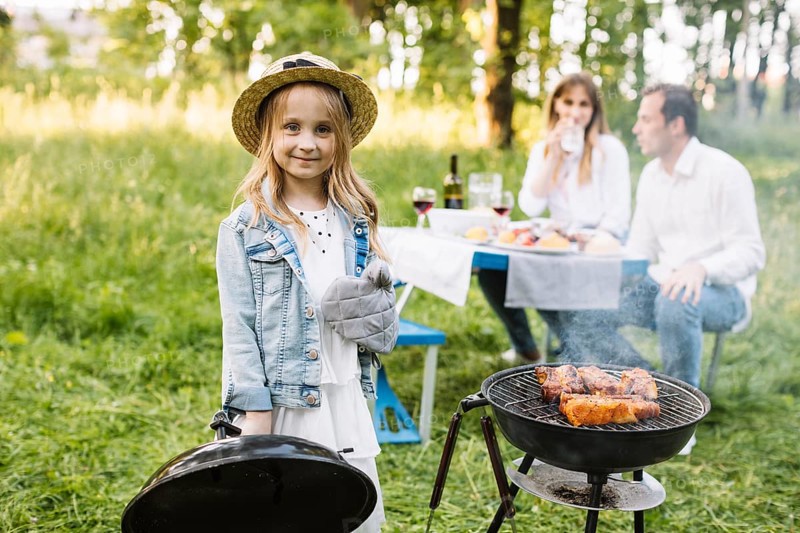 Family doing barbecue nature