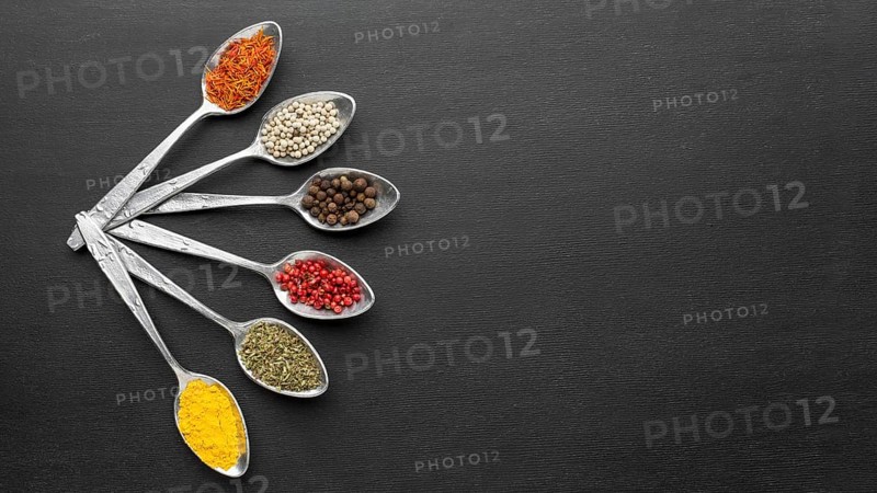 Copy space spoons with powder condiments