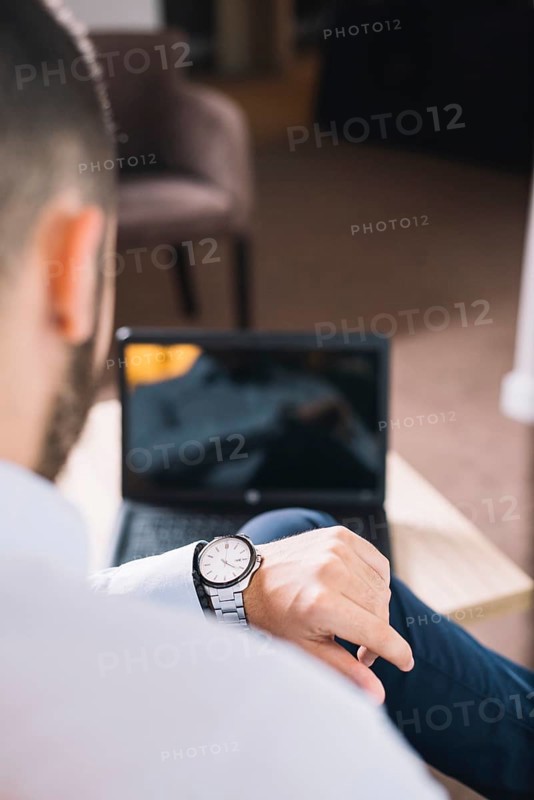 Businessman looking wristwatch