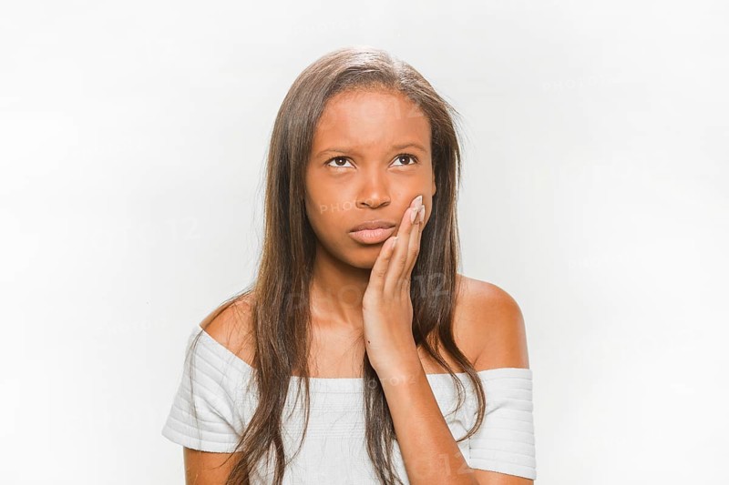 Portrait teenage girl suffering from tooth pain