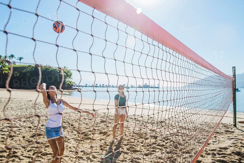 Young girls playing volley beach