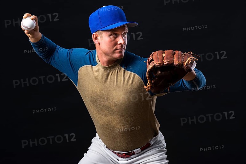 Man posing with baseball glove ball