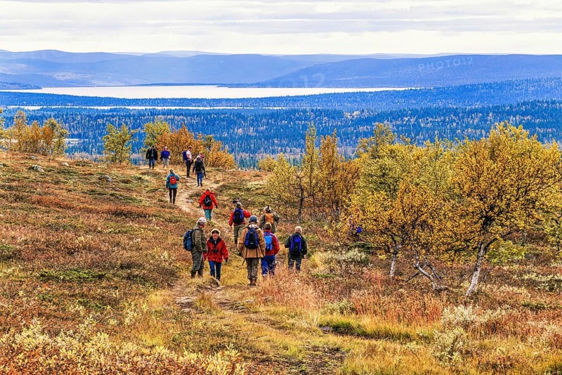 People hiking in a beautiful landscape in the swedish mountains at autumn