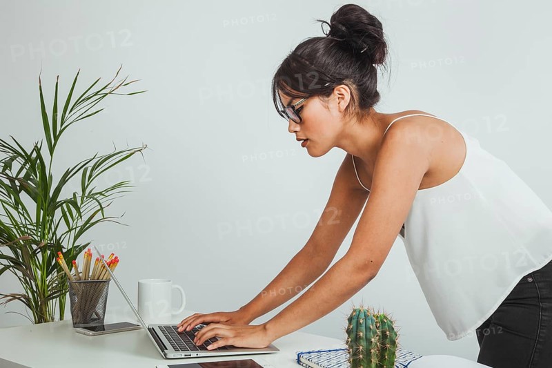 Businesswoman working with bad posture
