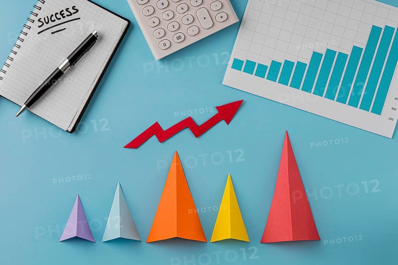 Top view business items with growth cones arrow