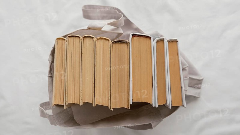 Top view books stack bag