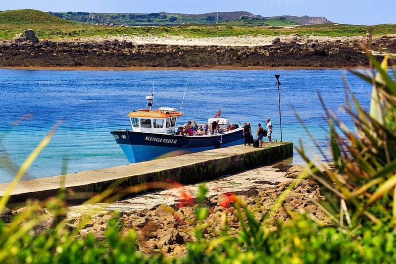 Tourist group on tour boat at jetty